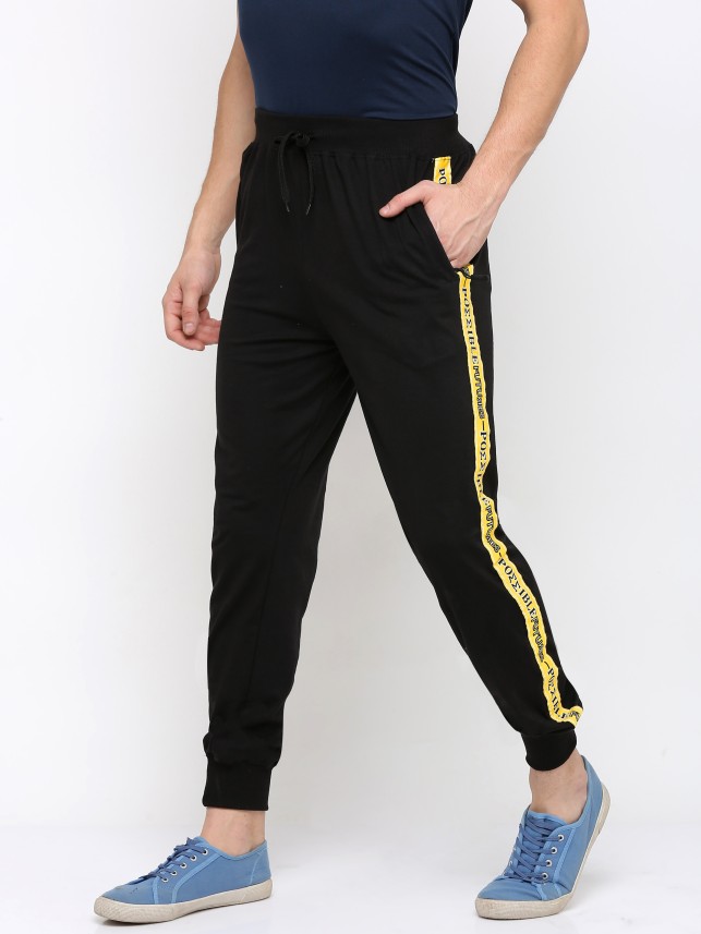 yellow track pants with white stripe