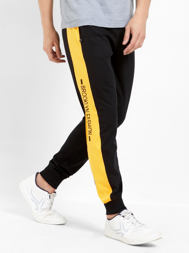 track pants black and yellow