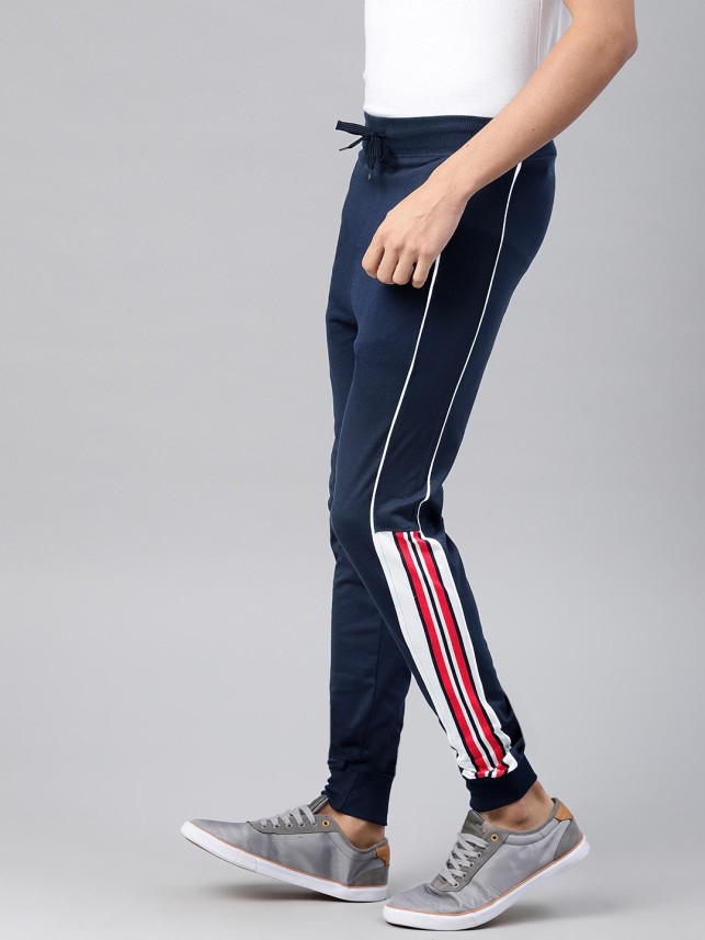 blue track pants with red stripe