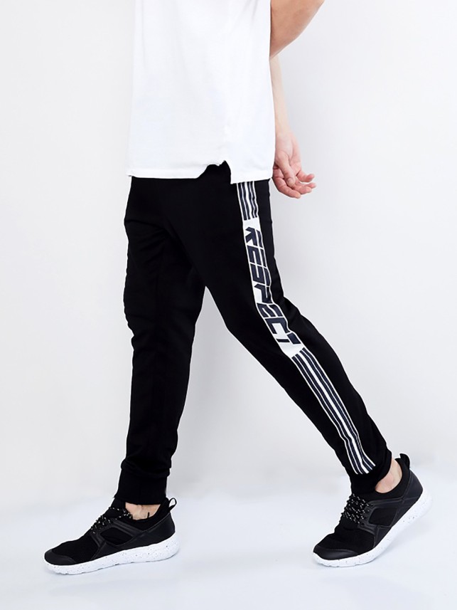 black track pants with white stripe