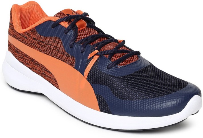 navy blue and orange pumas