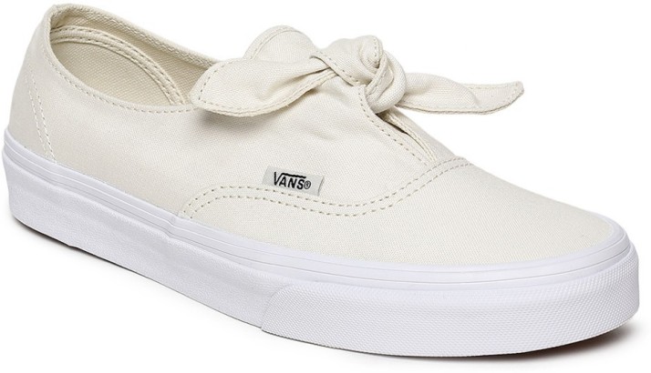 cream colored slip on vans