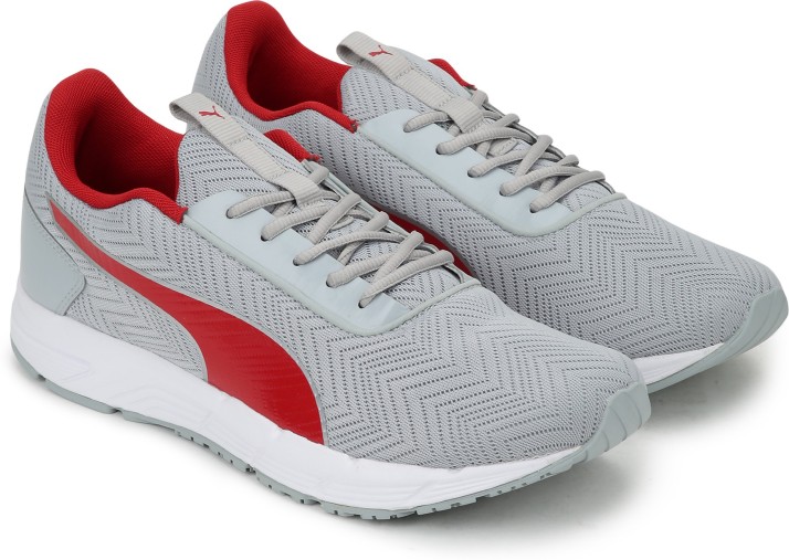 red and gray puma shoes