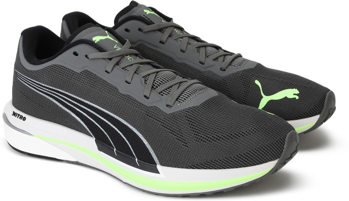 grey and green puma shoes