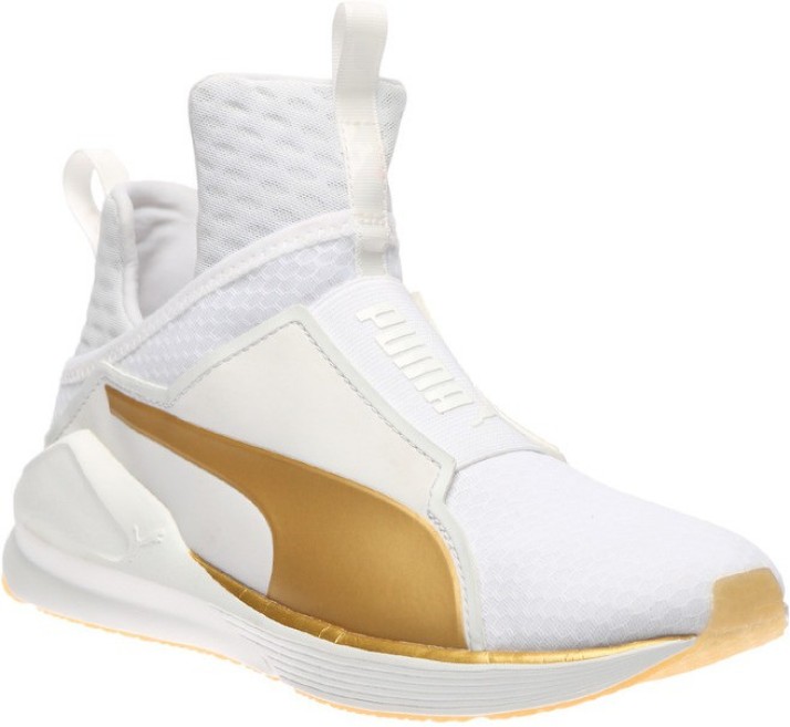 white and gold gym shoes