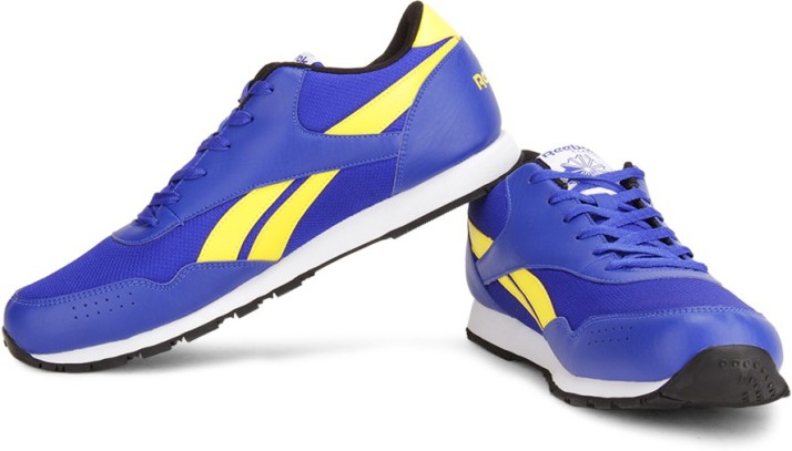 blue and yellow reebok classic