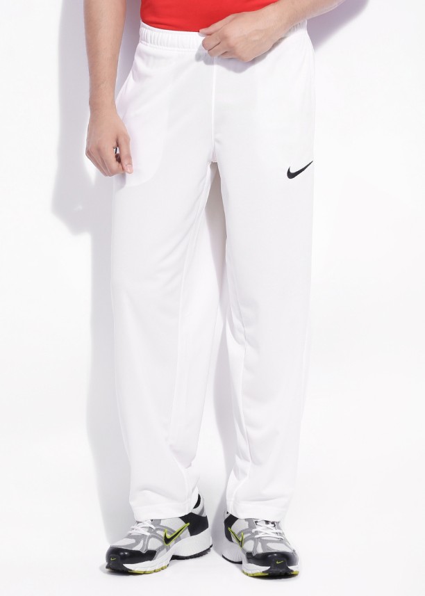 white nike trousers