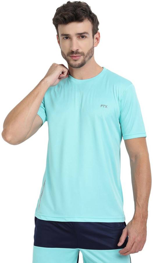 Solid Men Round Neck Light Blue T-Shirt Price in India