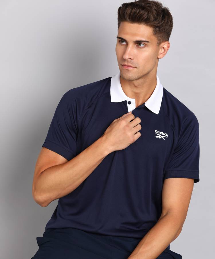 Solid Men Polo Neck Navy Blue T-Shirt Price in India