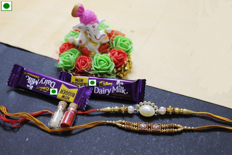 ajmera sales Designer Rakhi  Set(Two rakhi, Two chocolate, one flower ganesh ji plate, roli chawal set)