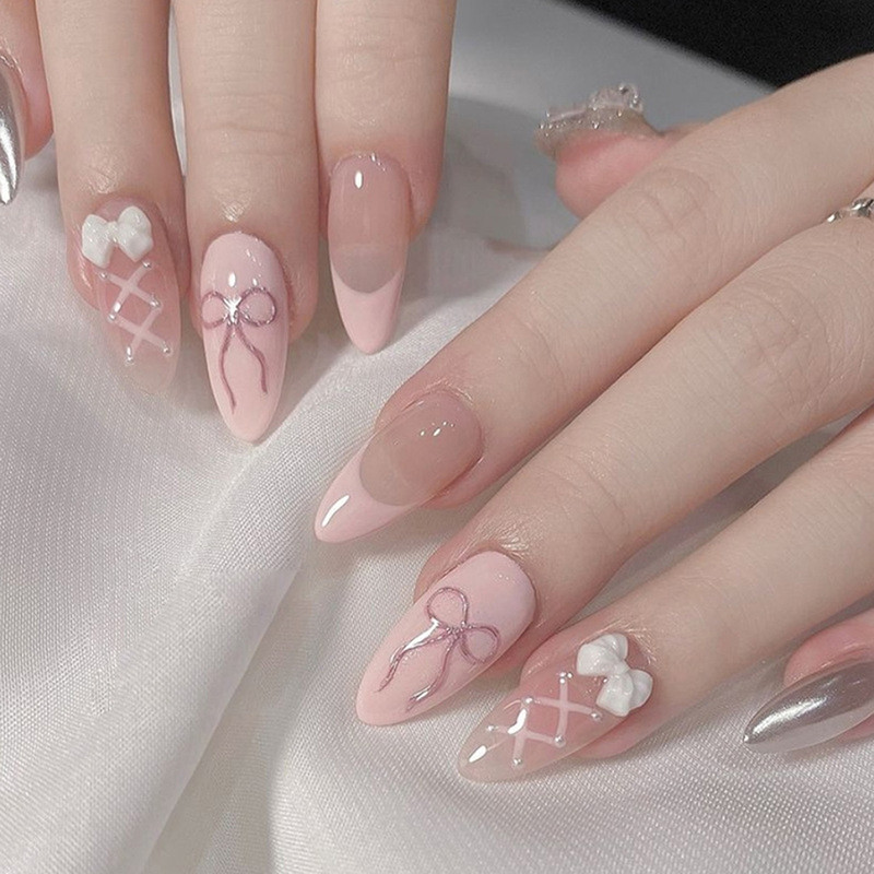 The Violet Tag 24 pc reusable press on nails in Baby pink with criss cross bow design with glue Pink(Pack of 24)