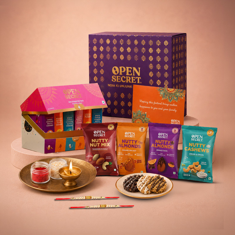 OPEN SECRET Rakhi Gift Hamper for Brother | 12 Cookies, 4 Flavoured Nuts, 2 Rakhis & Card Assorted Gift Box(Purple)