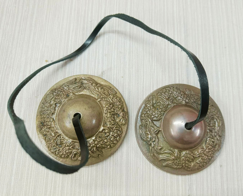 The Healing Store brass tingsha bell manjeera for meditation om mani mantra with leather chord Kartal Instrument