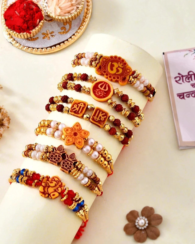 Designer Rakhi Combo of 6 Dora Rakhi Set for Brother Bhai Bhabhi Kids with Roli Chawal and Best Wishes Greeting Card, rakhi set of 6 Mauli Thread Rakhi, Chawal Roli Pack, Greeting Card Set by Flipkart SmartBuy(Set of 6 Multi Design Rudraksh Rakhi for Bhaiya Bhabhi Kids, 2 Traditional Om Swastik Rudr