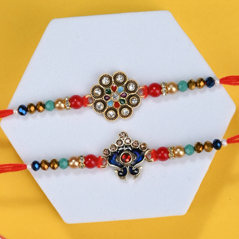 Designer Rakhi Assorted Rakhi by The Stone Aisle(2 Rakhi Set, 1 Roli, 1 Chawal)