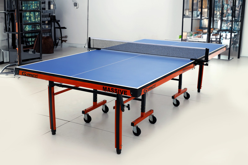 Gymnco Massive Top 25 mm Laminated, 100 mm wheels & get Cover + 2 TT Racket & Balls Rollaway Indoor Table Tennis Table(Blue)