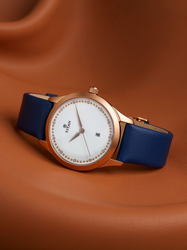 Titan NN2570WL02 Titan Sparkle With Date White Dial Blue LeatherStrap Analog Watch  - For Women