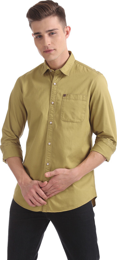 khaki shirt with blue jeans