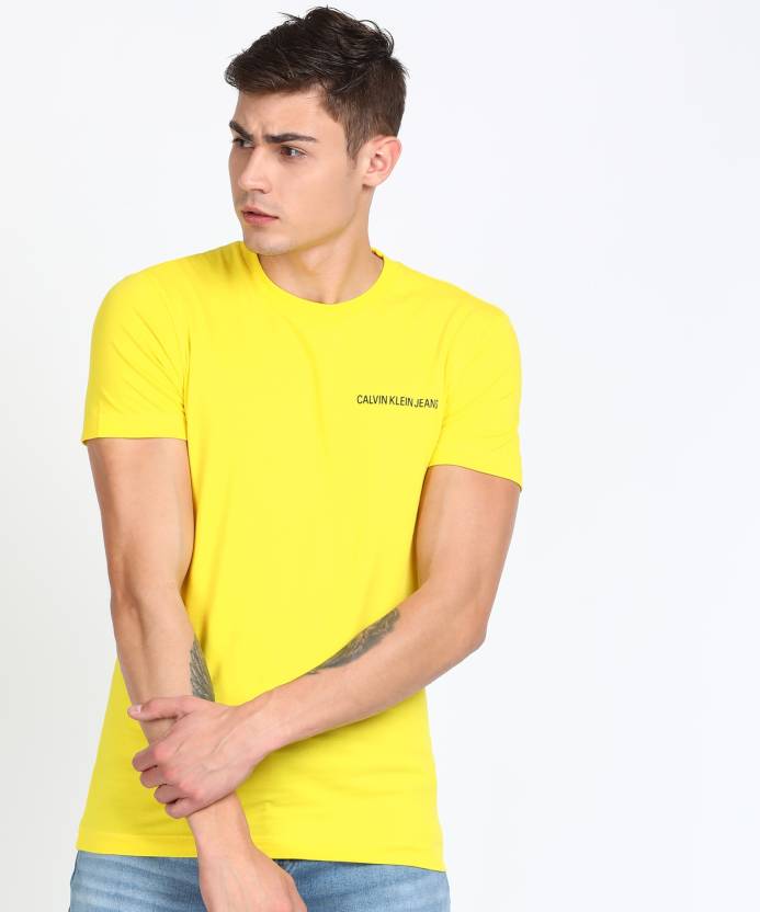 Calvin Klein Jeans Solid Men Round Neck Yellow T-Shirt - Buy Calvin Klein  Jeans Solid Men Round Neck Yellow T-Shirt Online at Best Prices in India |  