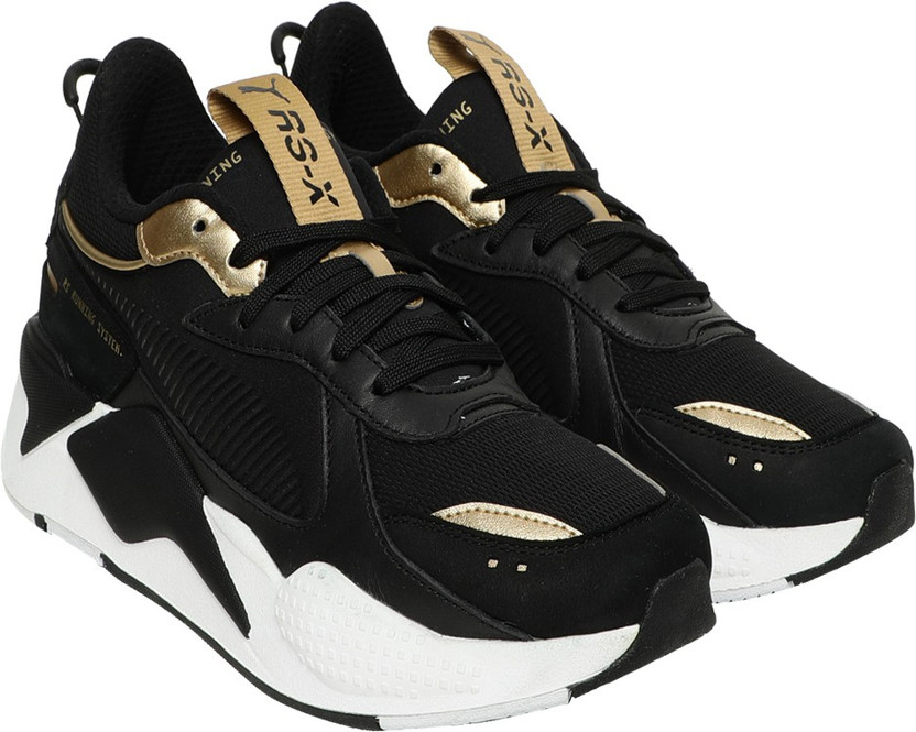 black and gold pumas