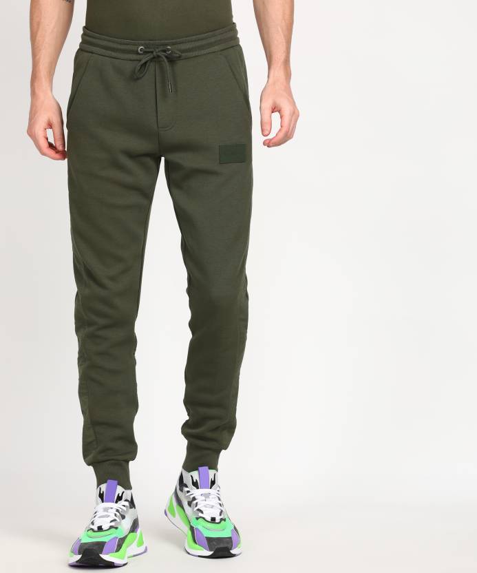 Calvin Klein Jeans Solid Men Green Track Pants - Buy Calvin Klein Jeans  Solid Men Green Track Pants Online at Best Prices in India 