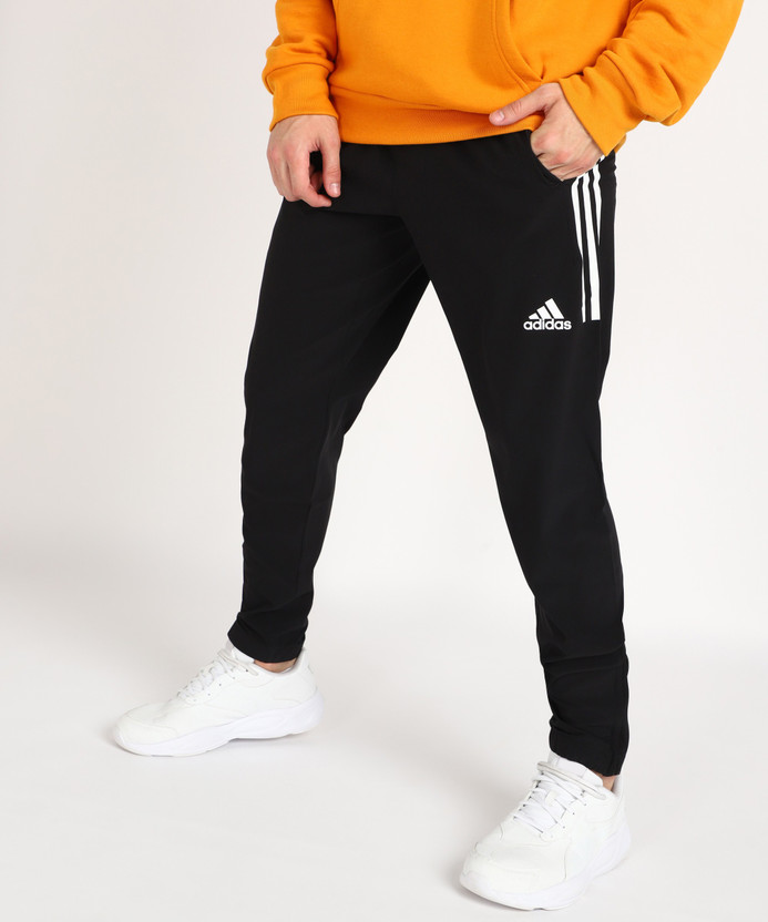 Black and yellow adidas track pants