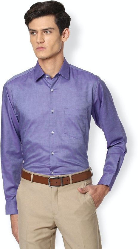 purple shirt beige pants