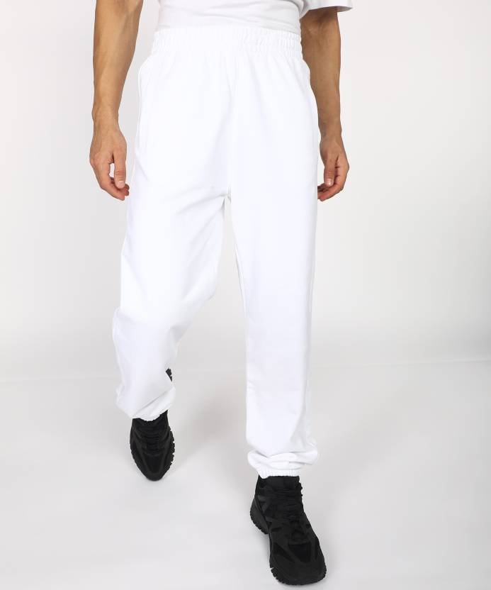 Calvin Klein Jeans Solid Men White Track Pants - Buy Calvin Klein Jeans  Solid Men White Track Pants Online at Best Prices in India 