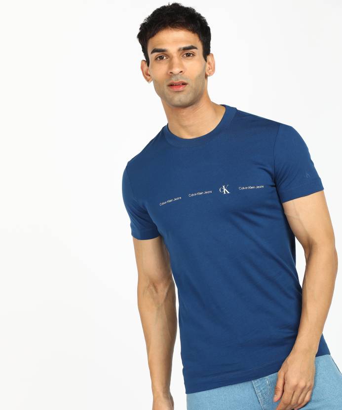 Calvin Klein Jeans Solid Men Round Neck Blue T-Shirt - Buy Calvin Klein  Jeans Solid Men Round Neck Blue T-Shirt Online at Best Prices in India |  