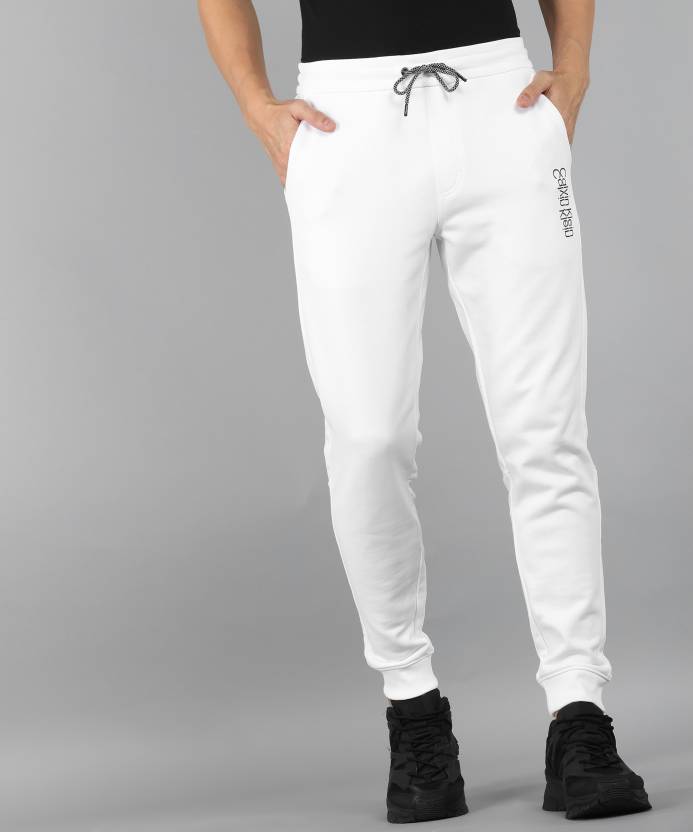 Calvin Klein Jeans Solid Men White Track Pants - Buy Calvin Klein Jeans  Solid Men White Track Pants Online at Best Prices in India 