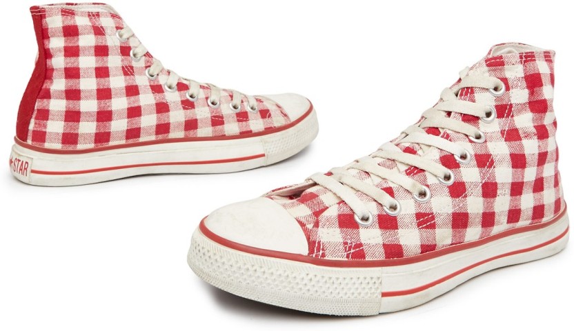 red and black checkerboard vans slip on