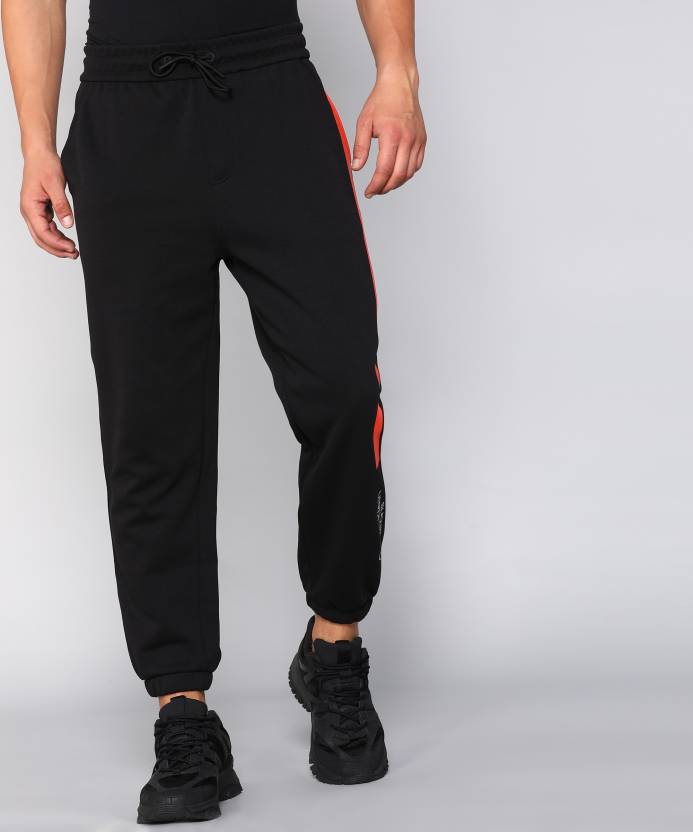 Calvin Klein Jeans Colorblock Men Black, Orange Track Pants - Buy Calvin  Klein Jeans Colorblock Men Black, Orange Track Pants Online at Best Prices  in India 