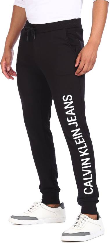 Calvin Klein Jeans Solid Men Black Track Pants - Buy Calvin Klein Jeans  Solid Men Black Track Pants Online at Best Prices in India 
