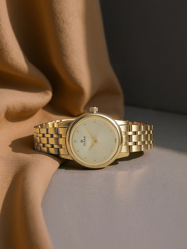 Titan NP2593YM01 Titan Karishma Champagne Dial Golden Stainless Steel Strap Analog Watch  - For Women