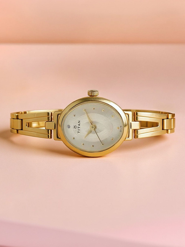 Titan 2594YM01 Titan Karishma Champagne Dial Golden Stainless Steel Strap Analog Watch  - For Women