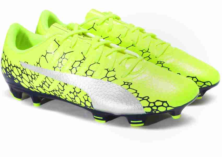 PUMA evoPOWER Vigor 4 GRAPHIC FG Football Shoes For Men - Safety Yellow-Silver-Blue Depths Color PUMA Vigor 4 GRAPHIC FG Football Shoes For Men Online at Price - Shop