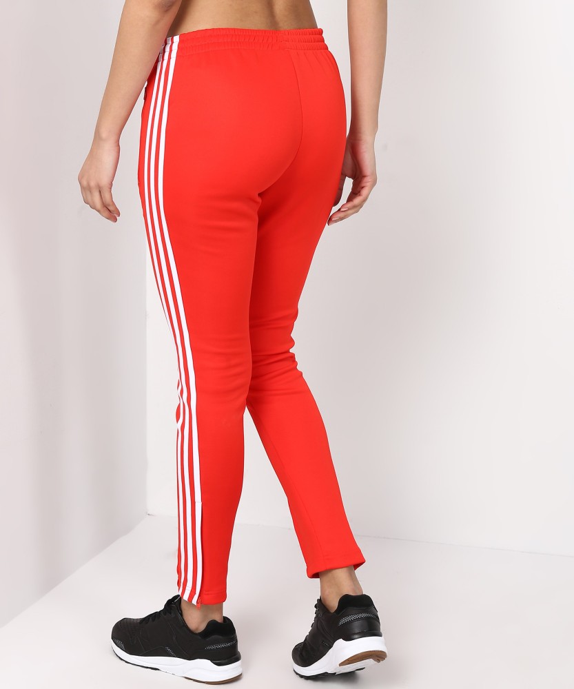 Red joggers with white stripe with contrasting red stars  Golden Goose