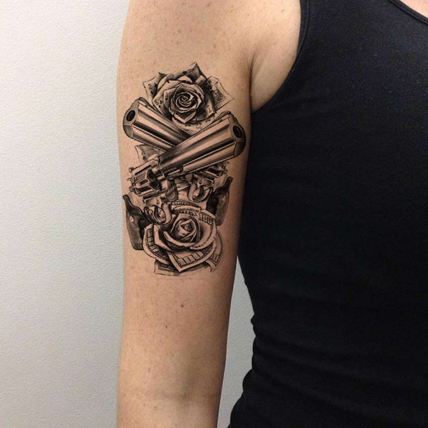 Rose And Gun Tattoo On Left Half Sleeve