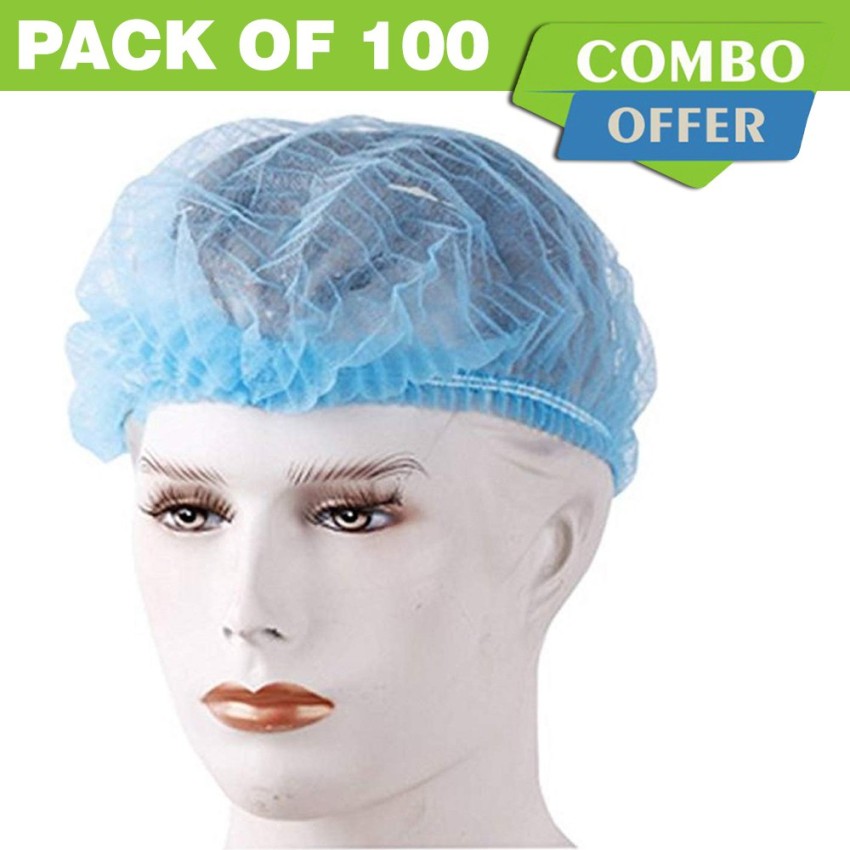 Smiling surgeon wearing navy blue scrubs hair cover and mask hanging down  pointing at himself Stock Photo  Alamy