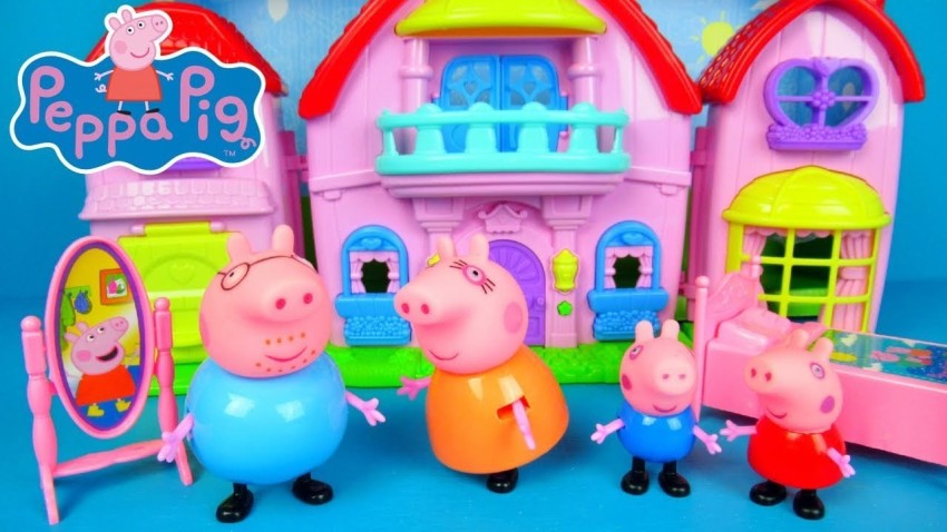 Plastic Peppa Pig toy house with different figurines Stock Photo