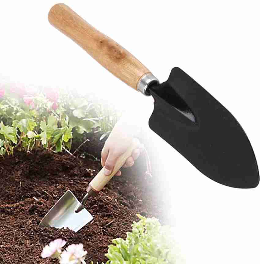 Hand digging new arrivals trowel
