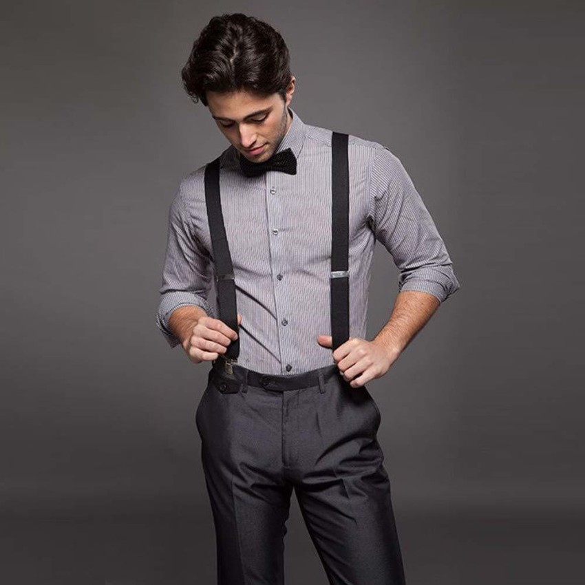 Brutal elegant man in gray classic pants and suspenders isolated on white  Stock Photo  Adobe Stock