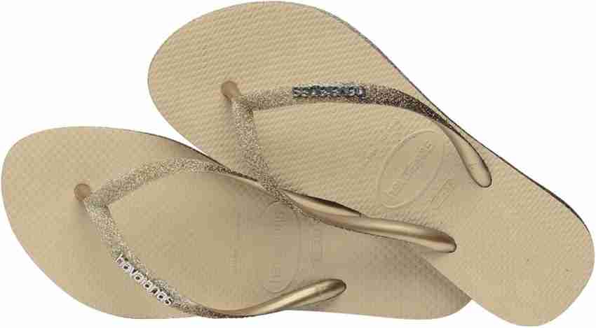 Havaianas gold and discount white flip flops