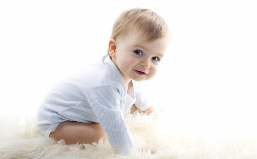 Download A sweet little baby boy in white Wallpaper  Wallpaperscom