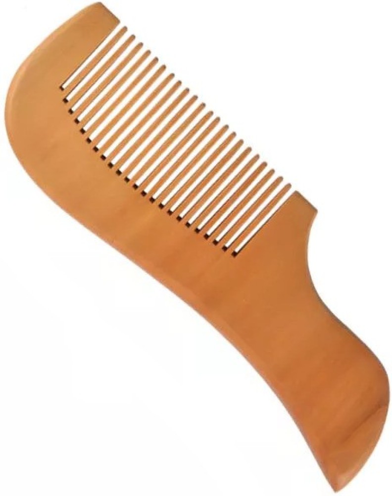 Premium Photo  A wooden hair massager comb and small rubber bands lie on a  white textured background