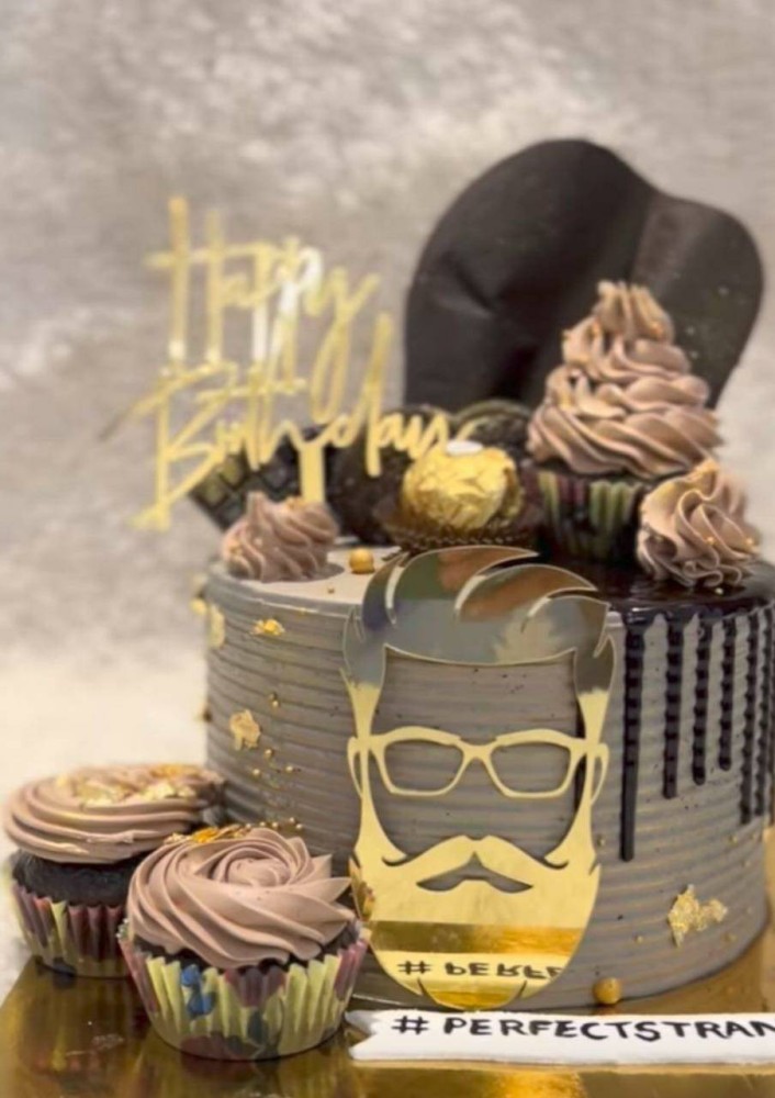 Young male hipster with a beard holding a cake with the inscription happy  birthday congratulations on the anniversary and the holiday. Concept of  promotions and discounts. | Stock image | Colourbox