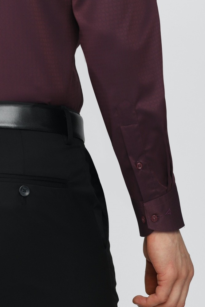 a man in a black and burgundy shirt and black pants with his arms out Stock  Photo by Icons8