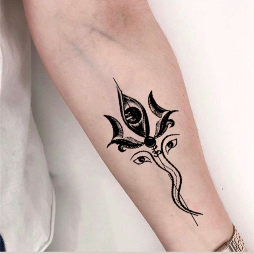 Ganesha Om tattoo on the forearm