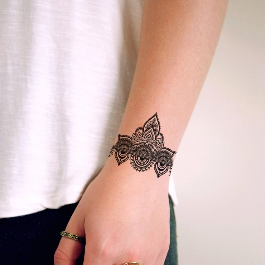 Mandala bracelet tattoo with bow  Wrist tattoos for women Tattoos for  women Cuff tattoo